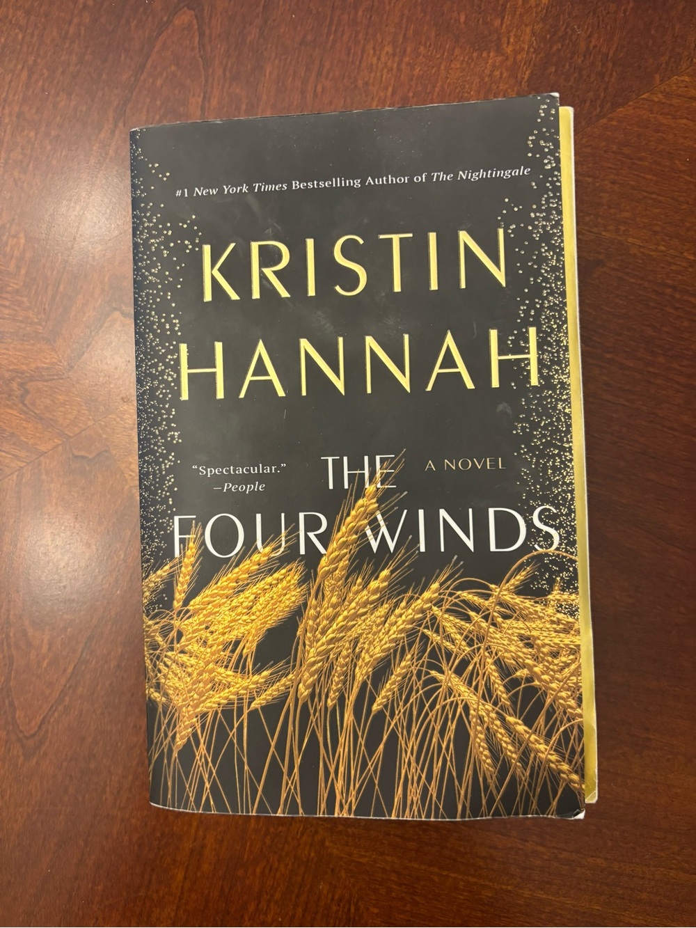 St. Martin's Press The Four Winds by Kristin Hannah Hardcover Novel Black & Gold